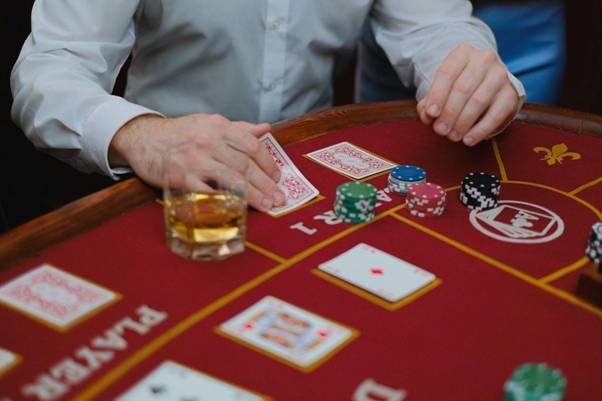 blackjack table with card player